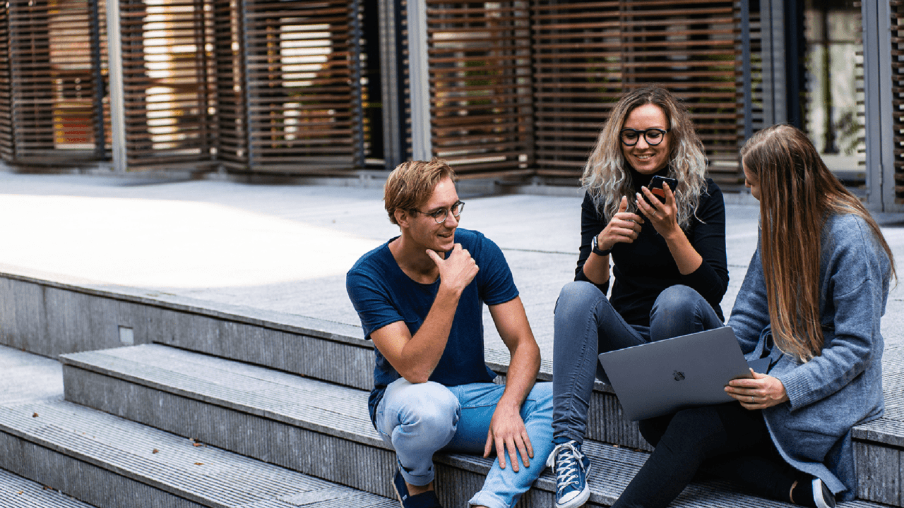 Students sitting on steps.
